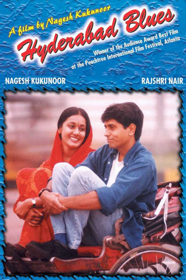 Two young adults walking side by side through a busy Hyderabad street at dusk, city lights beginning to glow, one talking while the other listens with an unreadable expression, warm cinematic tones